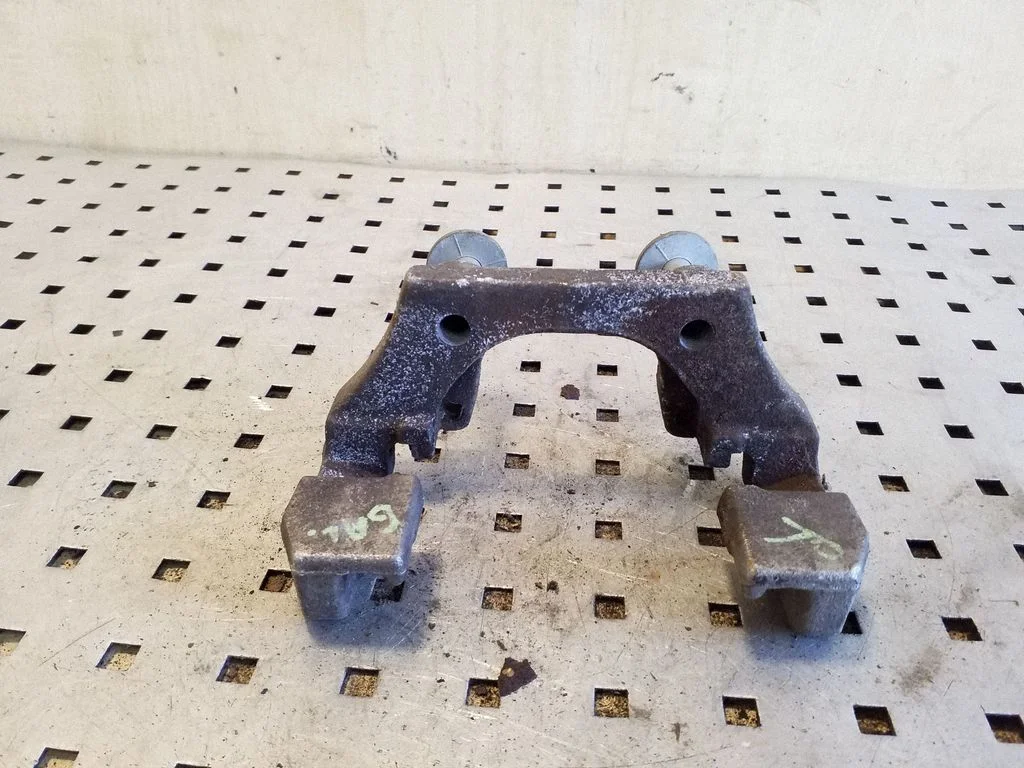 Brake caliper pad carrier rear