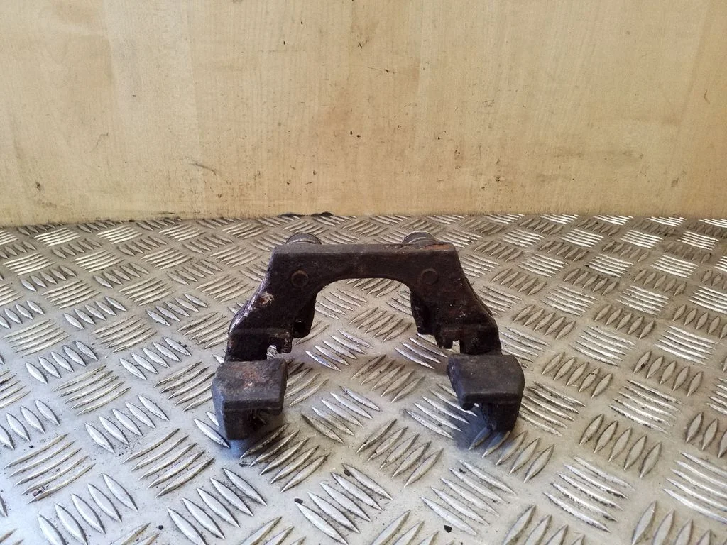 Brake caliper pad carrier rear