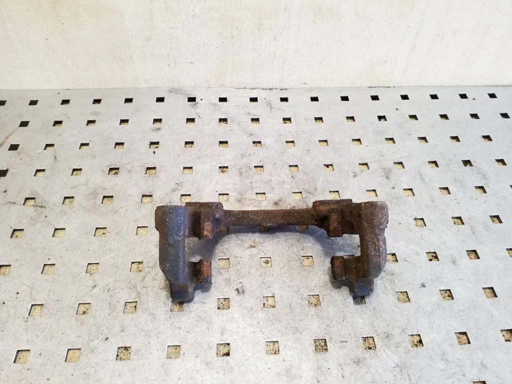 Brake caliper pad carrier rear – Mazda 3 II (2009-2013), left