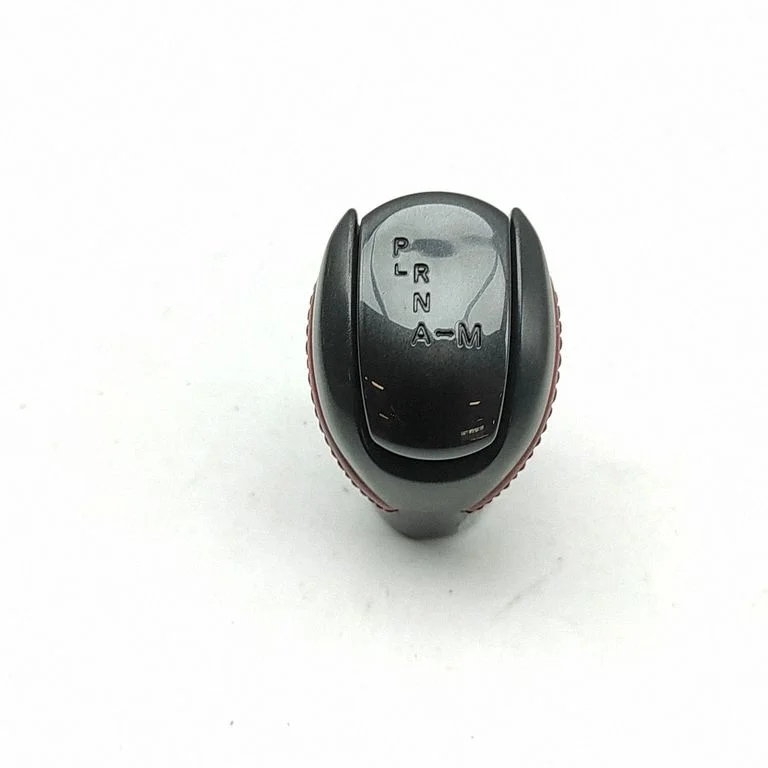 Pārnesumu pārslēga sviras apdare (āda, poga) 34910KB60A