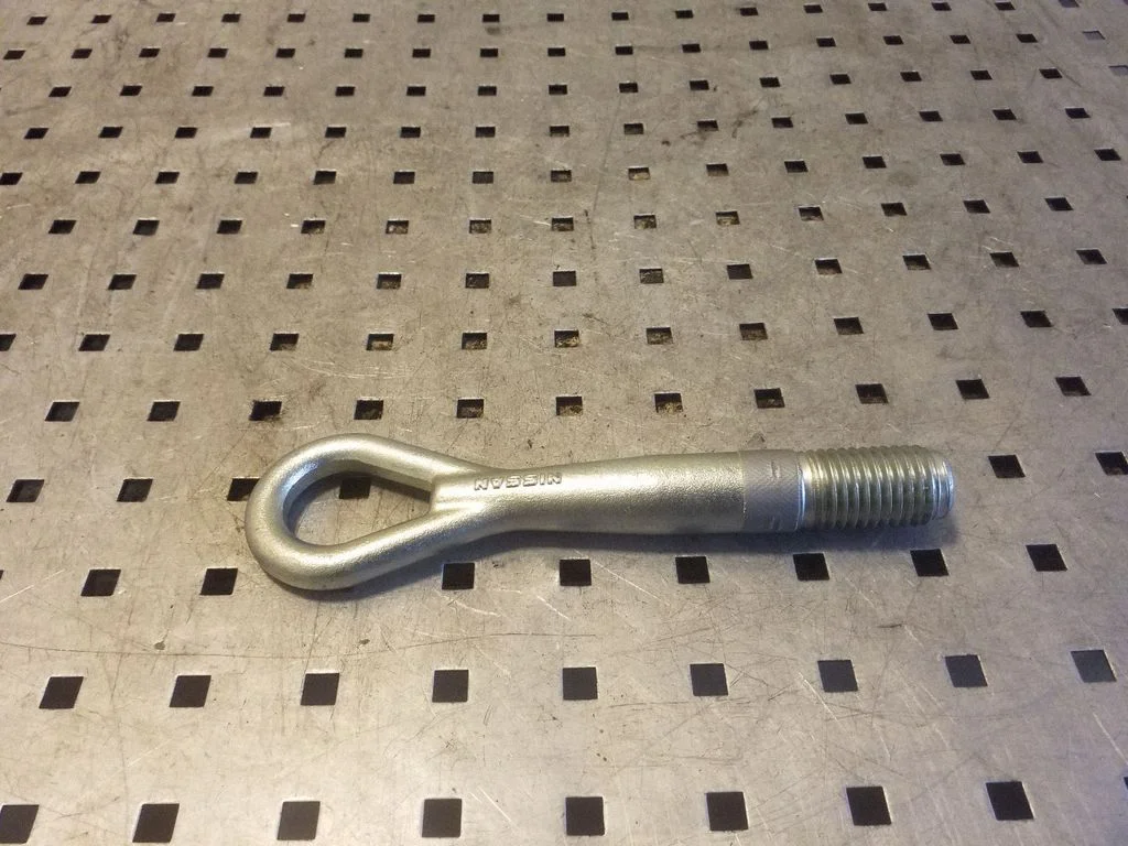 Towing hook eye