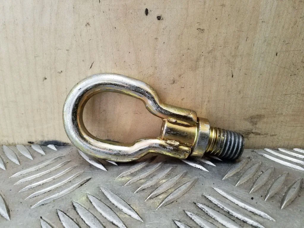 Towing hook eye