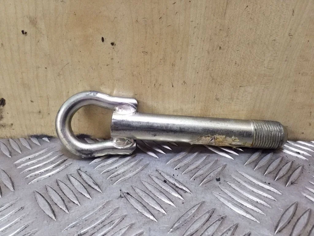 Towing hook eye