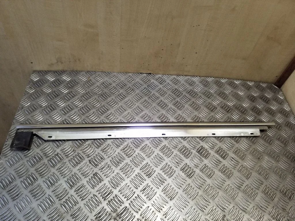 Rear door glass trim molding – left