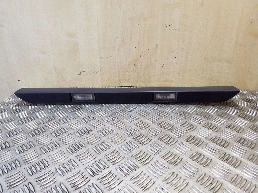 Trunk door license plate light bar 1307272070