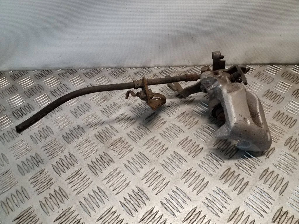 Rear brake caliper – left