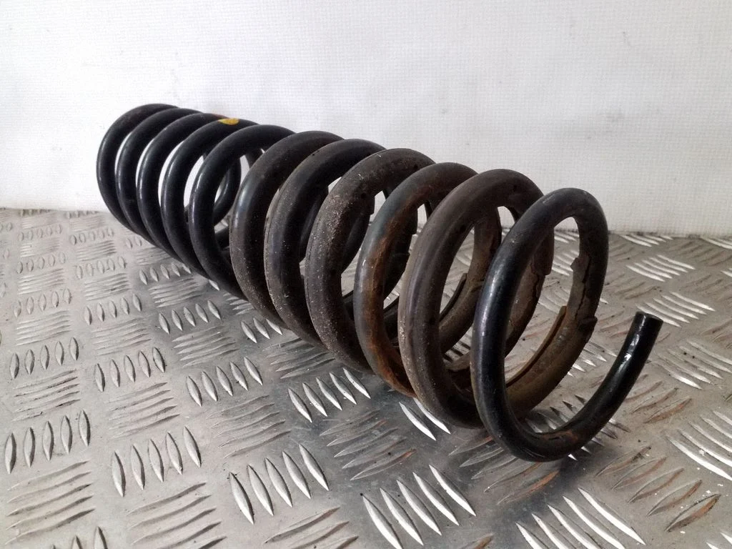 Rear coil spring – left