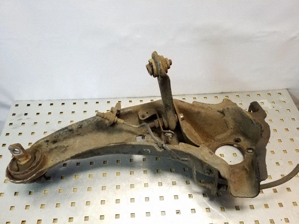 Rear upper control arm/wishbone – left