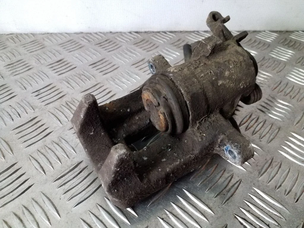 Rear brake caliper – left