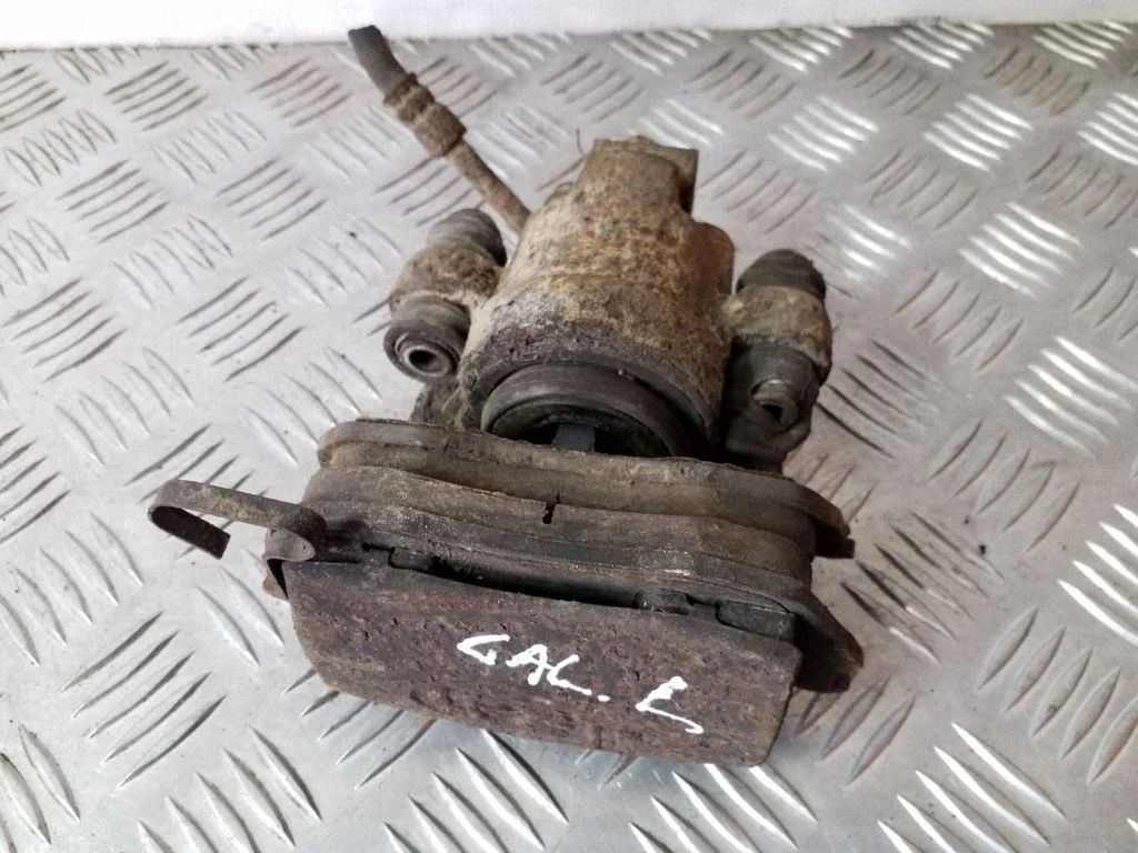 Rear brake caliper – left