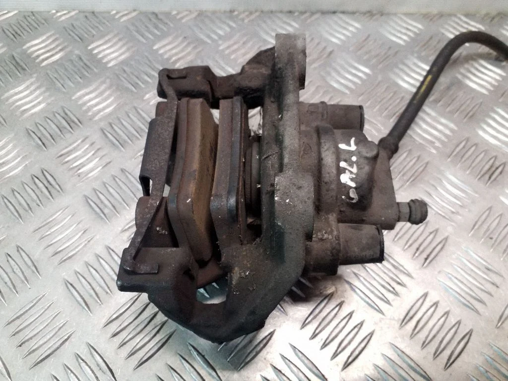 Rear brake caliper – left