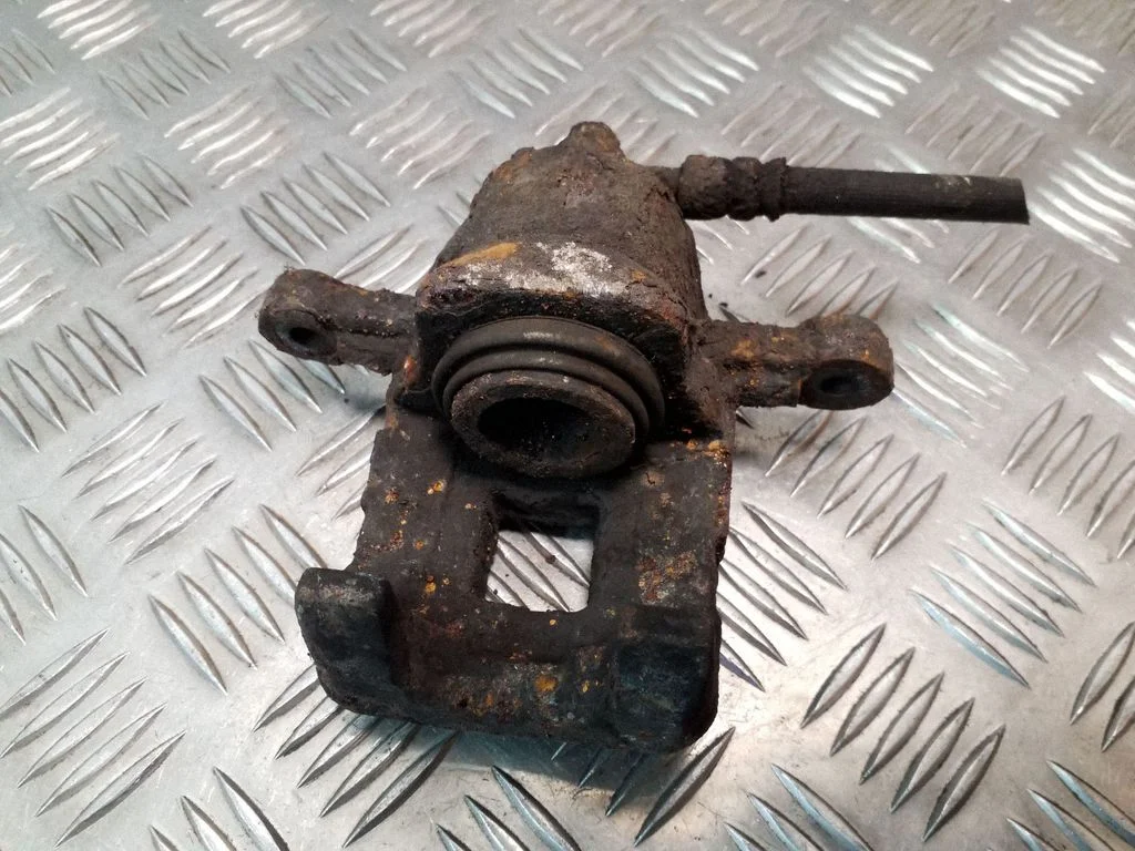 Rear brake caliper – left