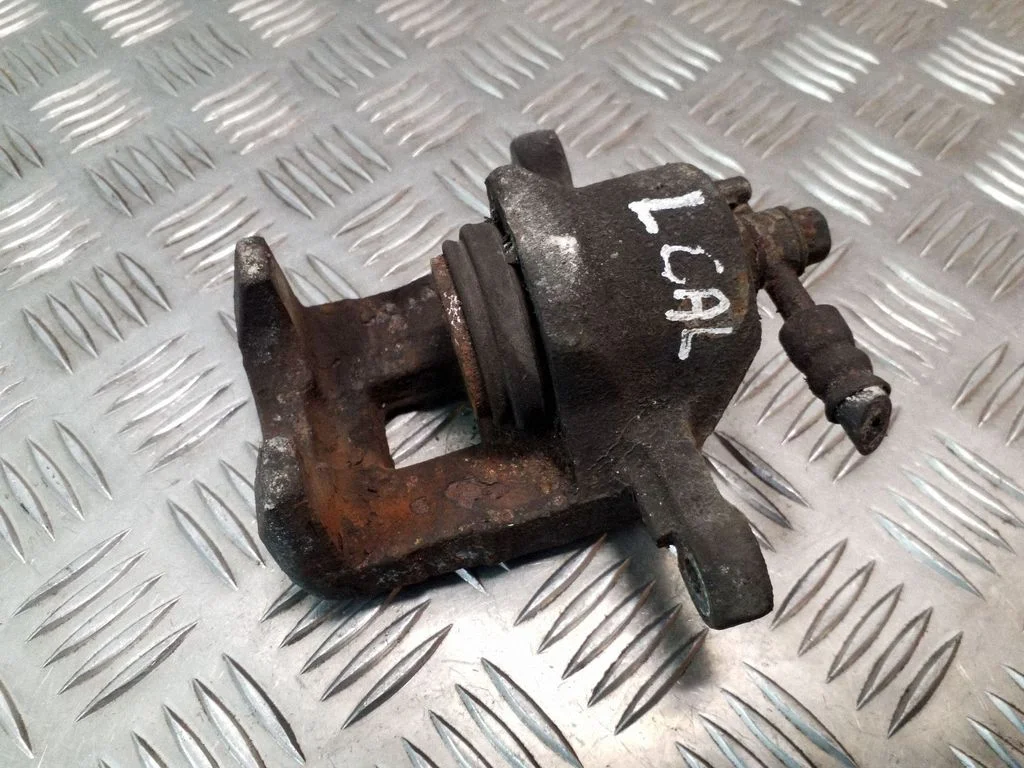 Rear brake caliper – left