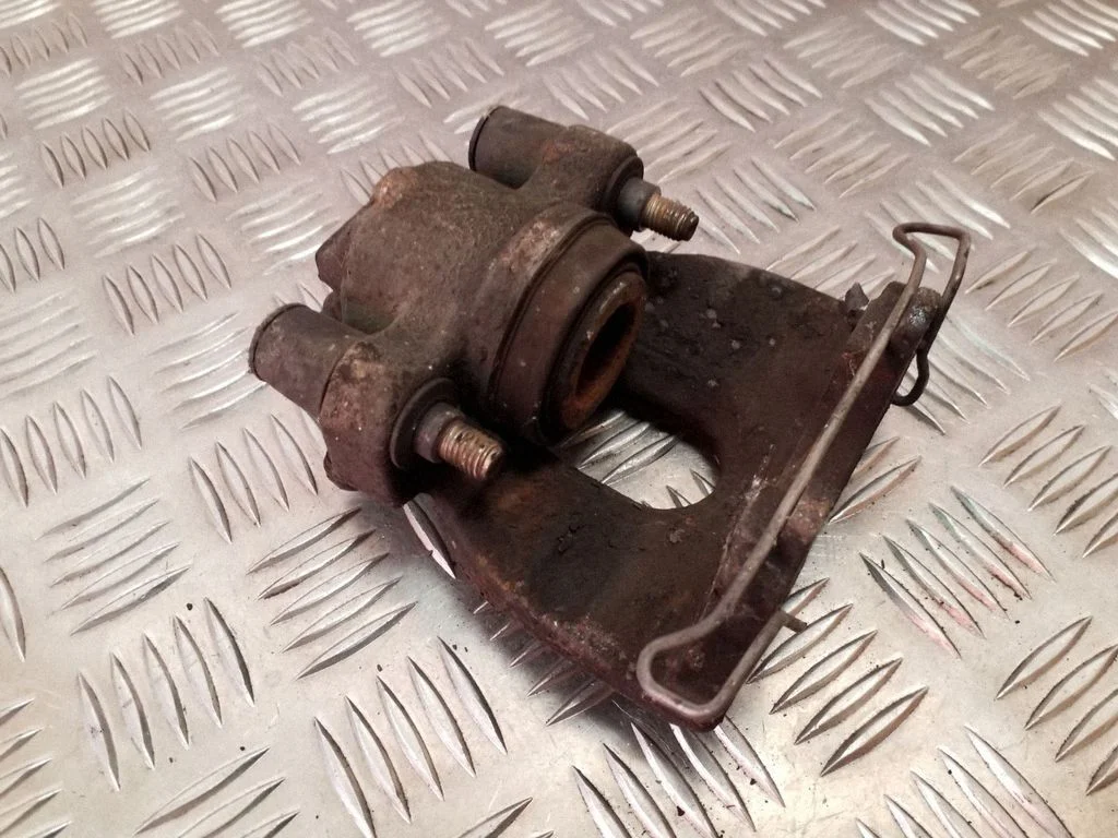 Rear brake caliper – left
