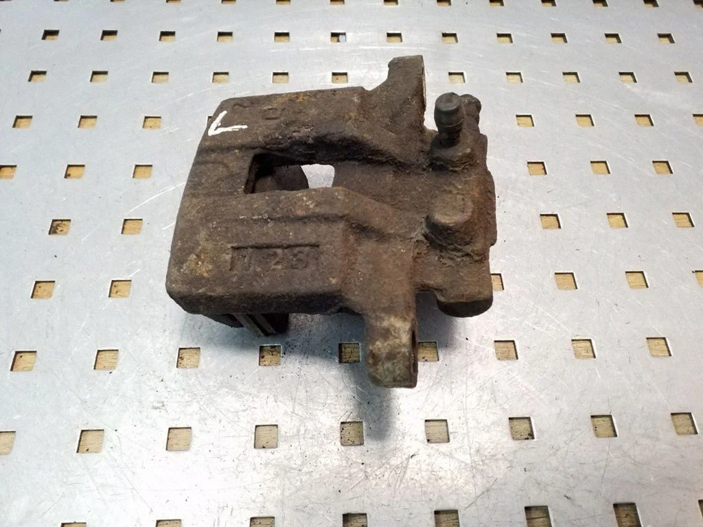 Rear brake caliper – left