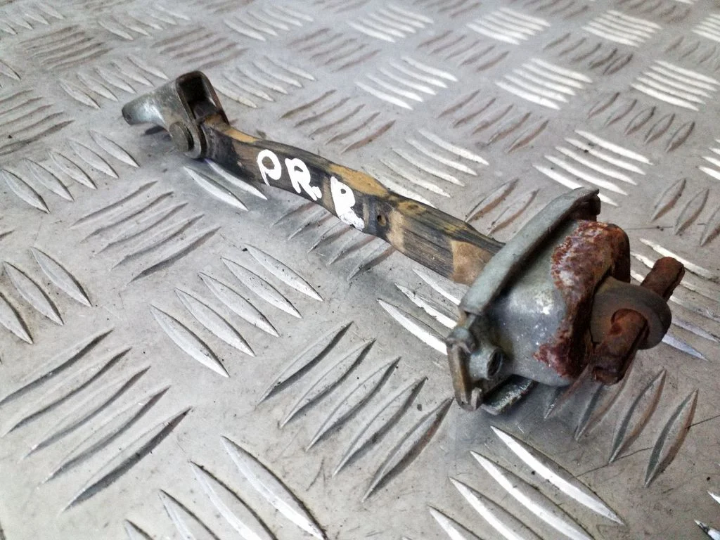 Front door check strap stopper – right