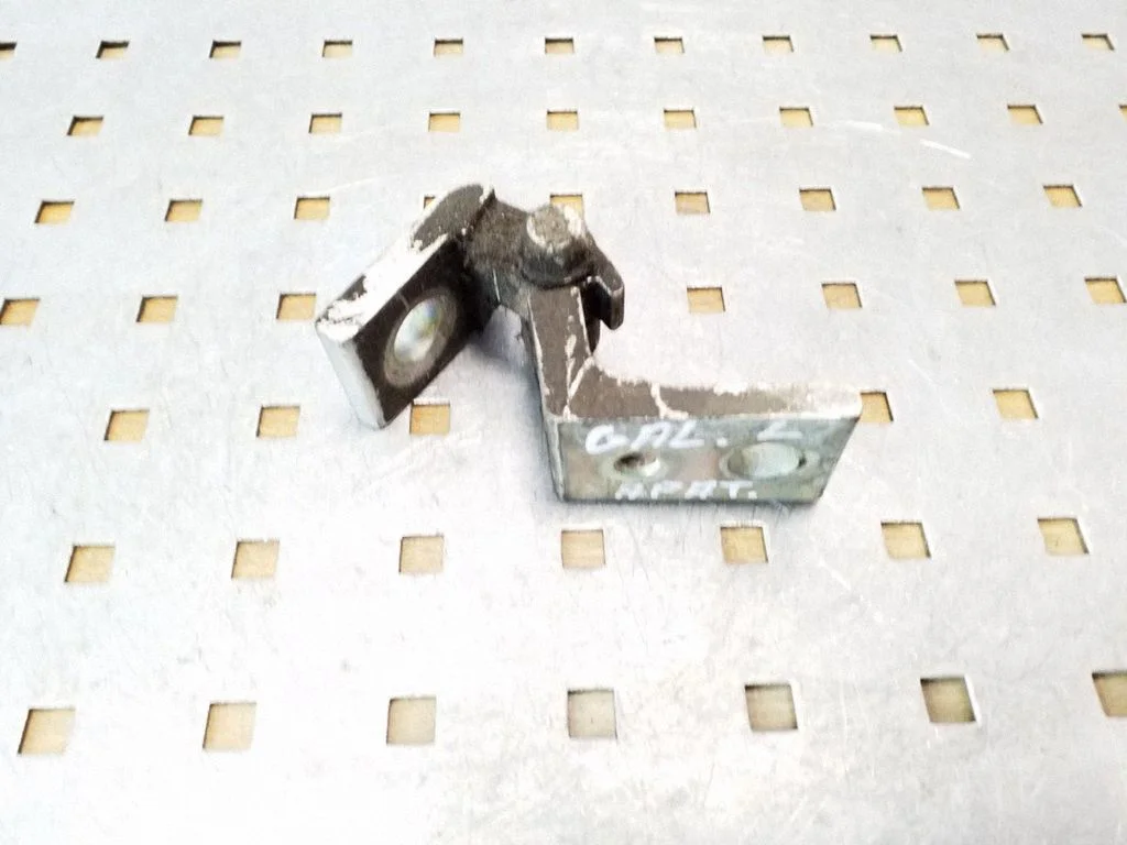 Rear door lower hinge – rear left