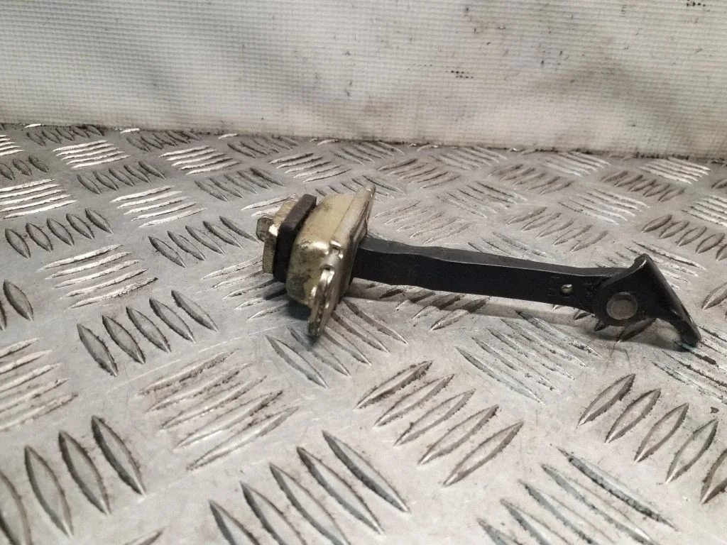 Rear door check strap stopper – right
