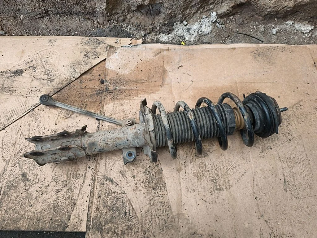 Front shock absorber with coil spring