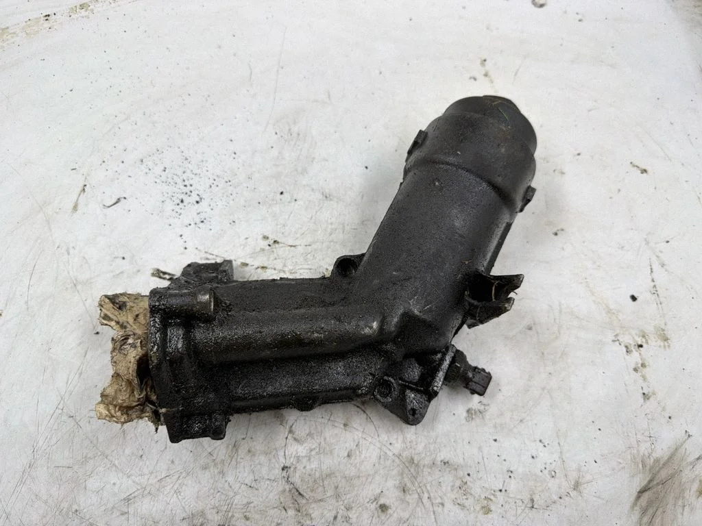 Oil filter mounting bracket 7787072