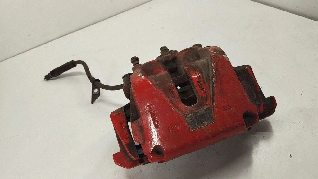 Front brake caliper E1GC2B294BA
