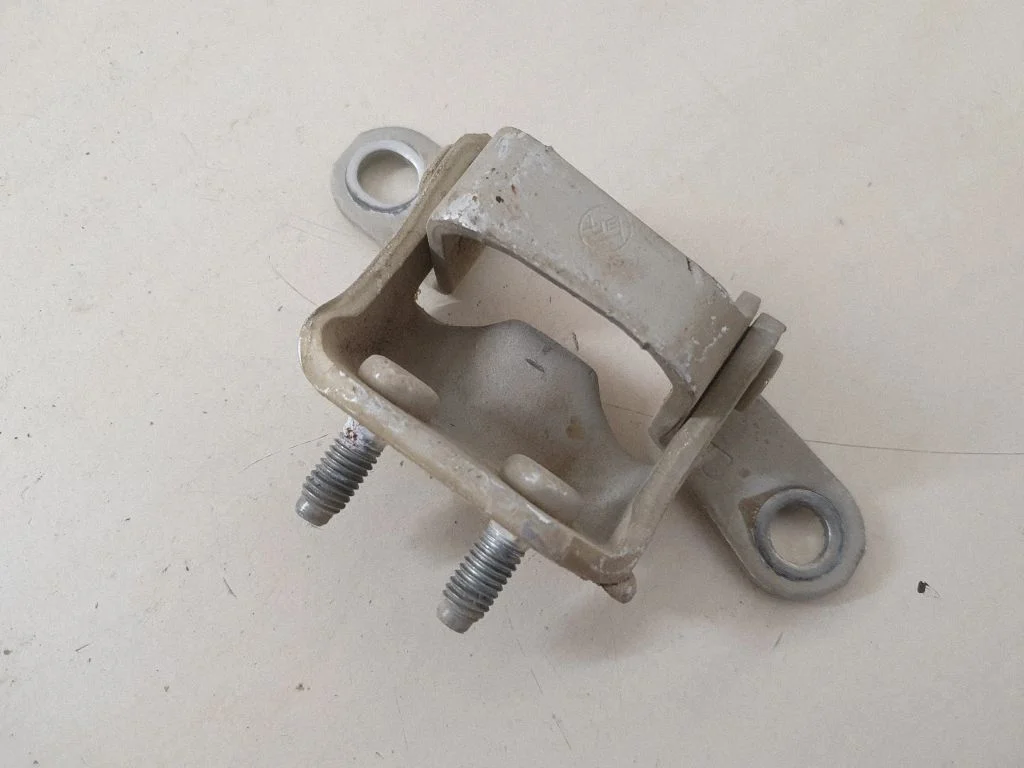 Rear door upper hinge – right