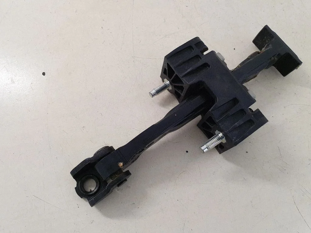 Rear door check strap stopper 31298467