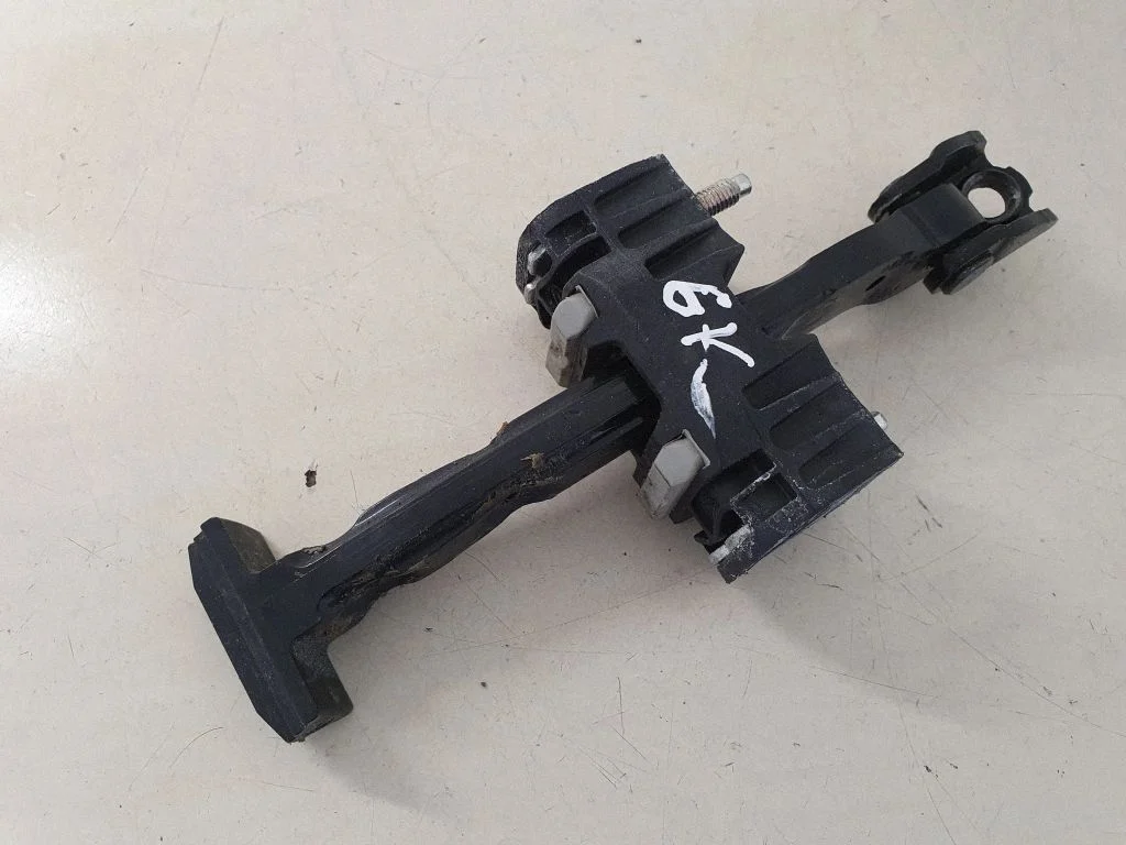 Rear door check strap stopper 31298467