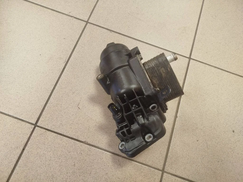 Oil filter mounting bracket 264102A300