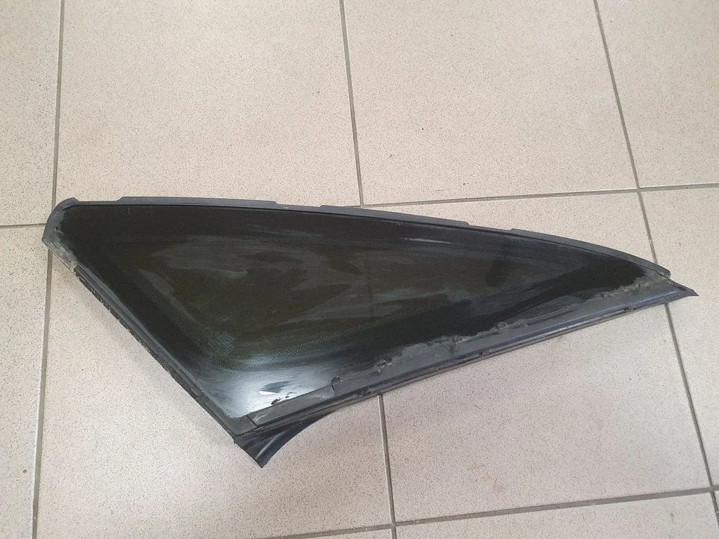 Rear side window – left