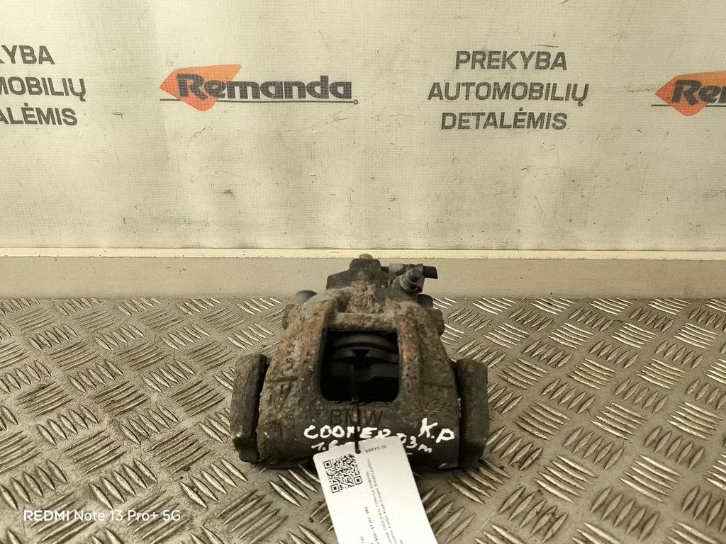 Zacisk hamulcowy przedni – lewy przód