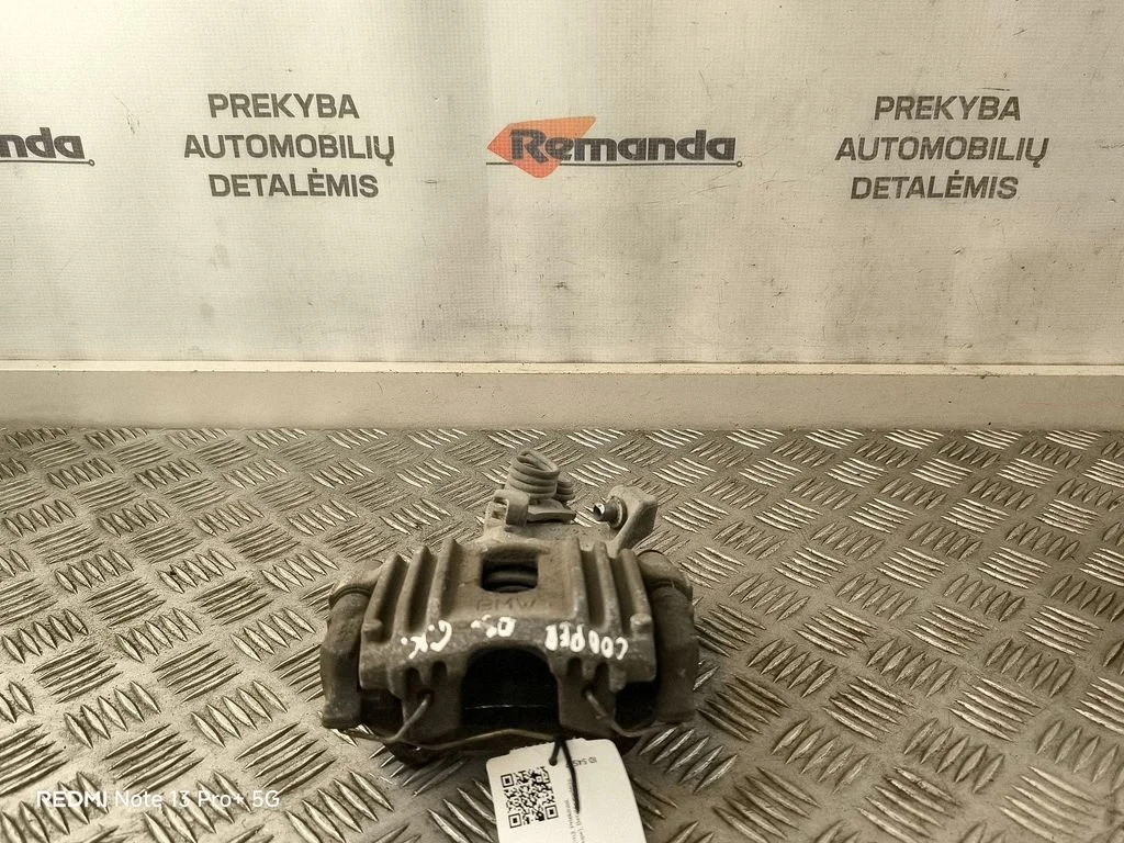 Zacisk hamulcowy tylny – lewy tył