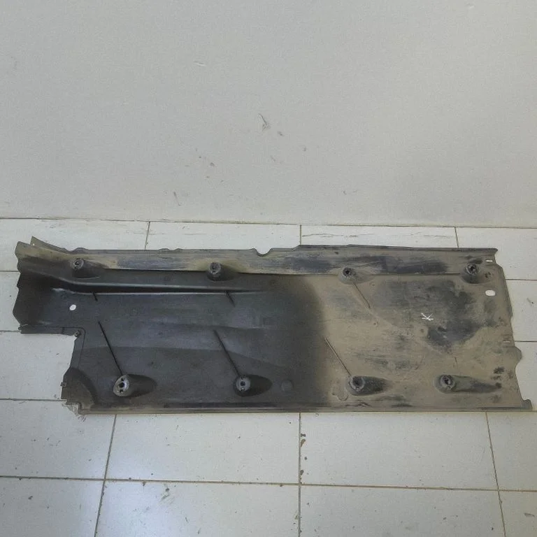 Center/middle under tray cover – left
