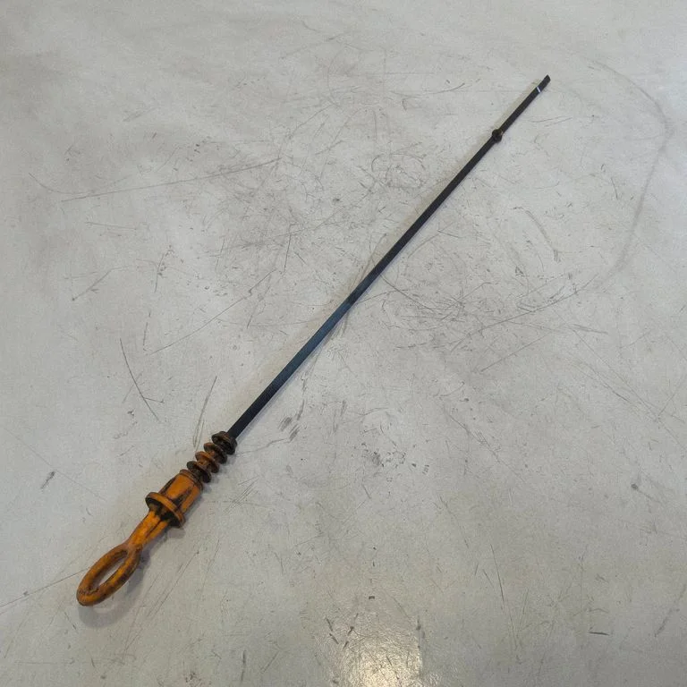 Oil level dip stick – front