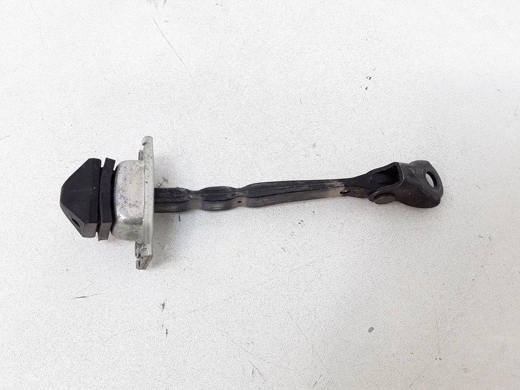Rear door check strap stopper – left