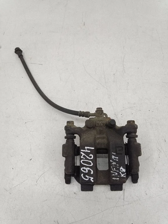 Rear brake caliper – left
