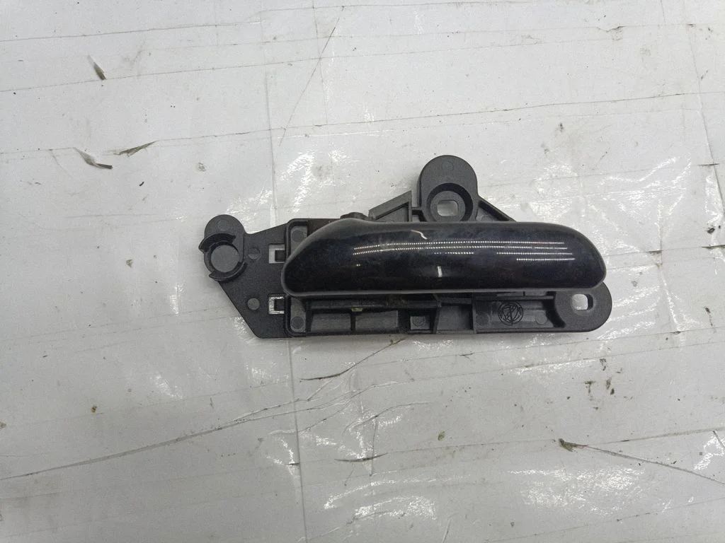 Rear door interior handle trim