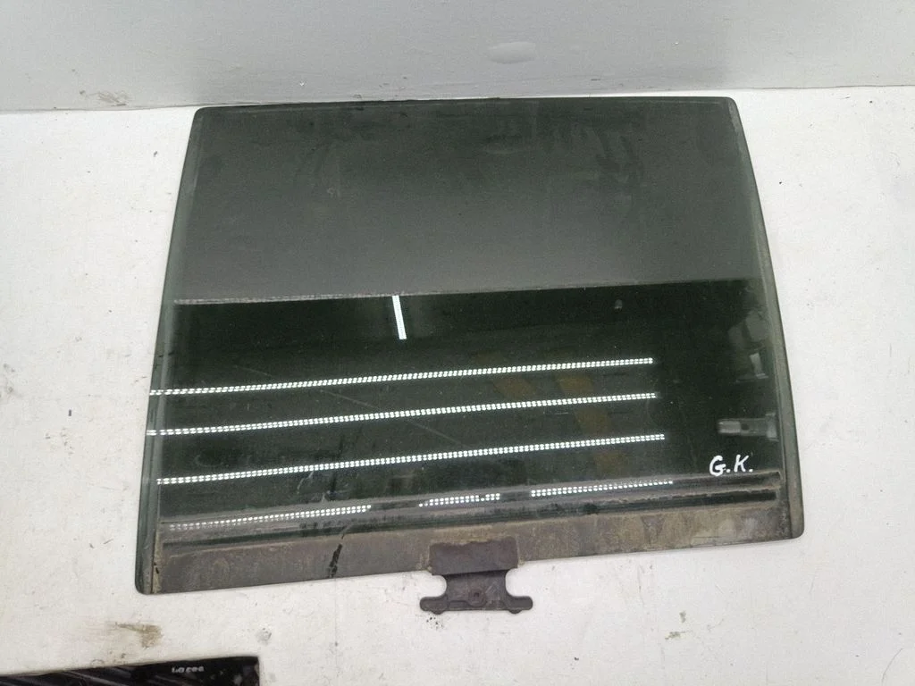Rear door window glass – left