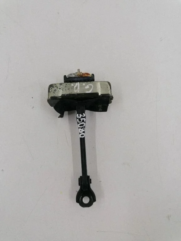 Rear door check strap stopper – right