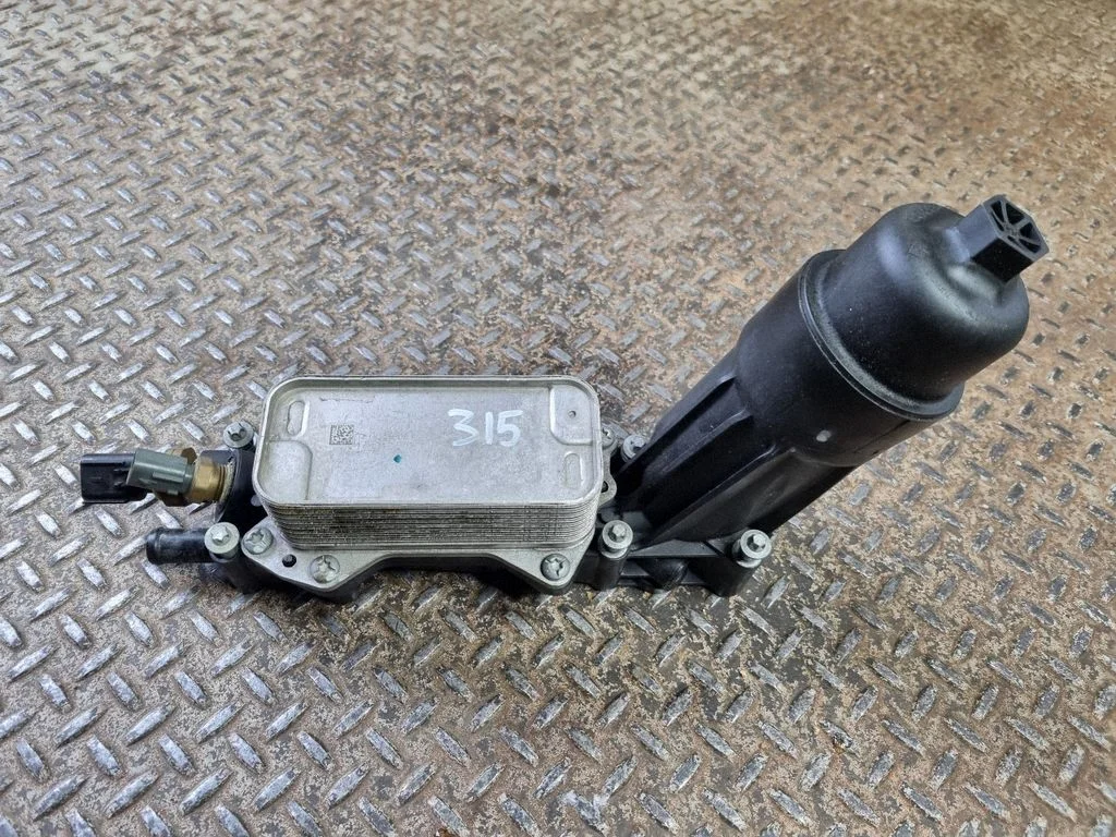 Oil filter mounting bracket 68310865AB