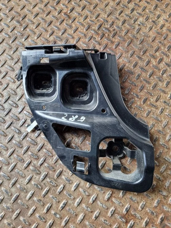 Rear bumper mounting bracket 7461397