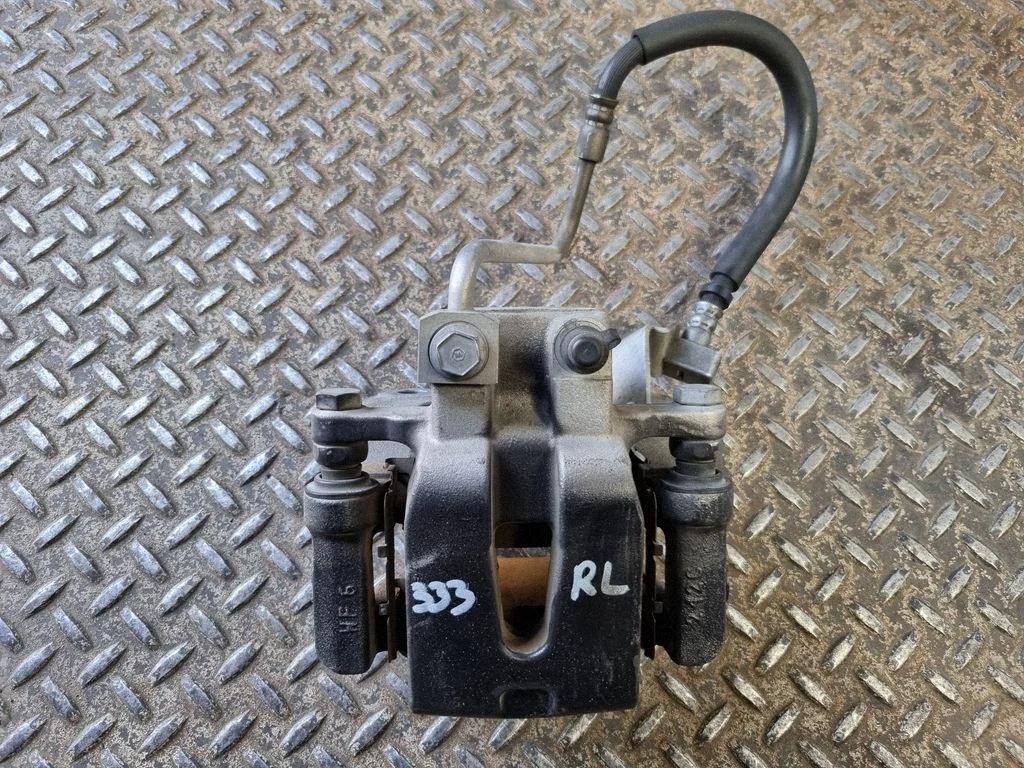 Rear brake caliper – left