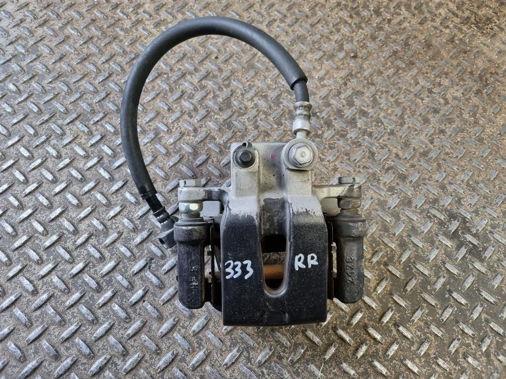 Rear brake caliper – right