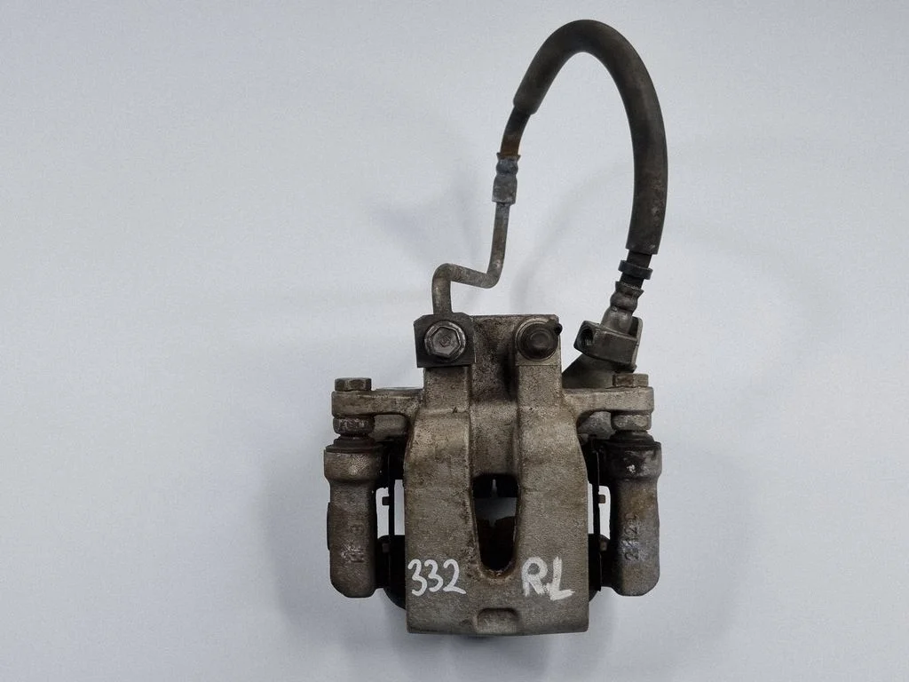 Rear brake caliper – left