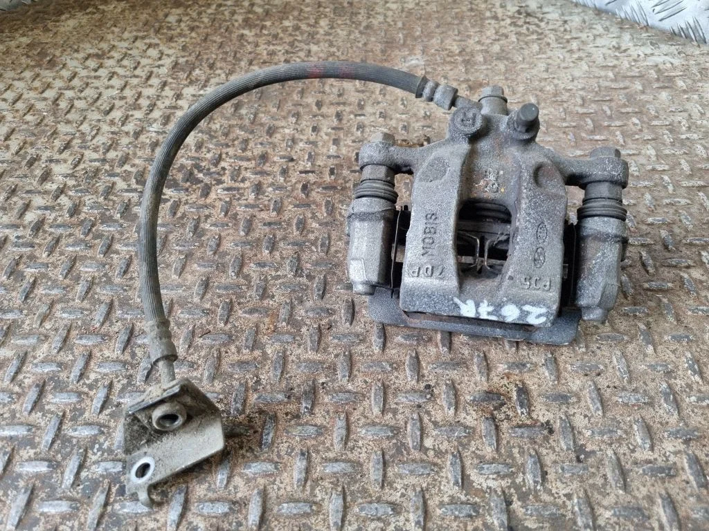 Rear brake caliper – right