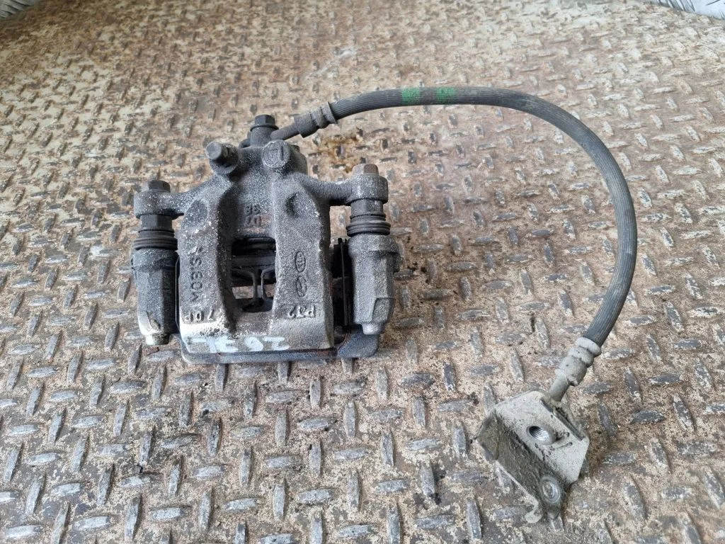 Rear brake caliper – left