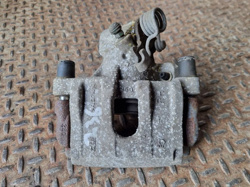 Rear brake caliper – right