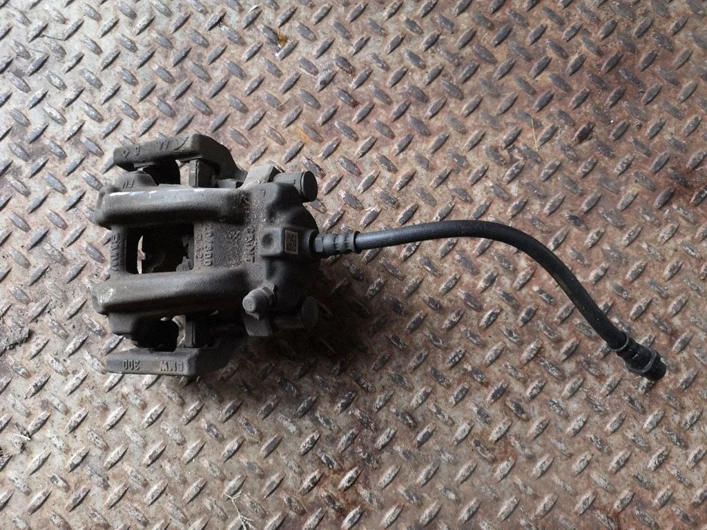 Rear brake caliper – right