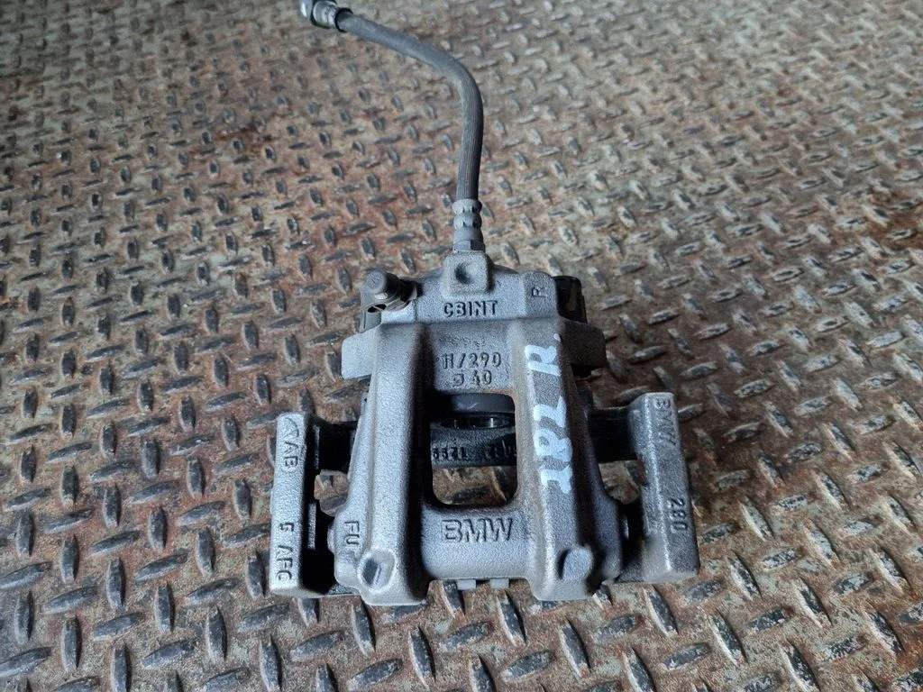 Rear brake caliper – right