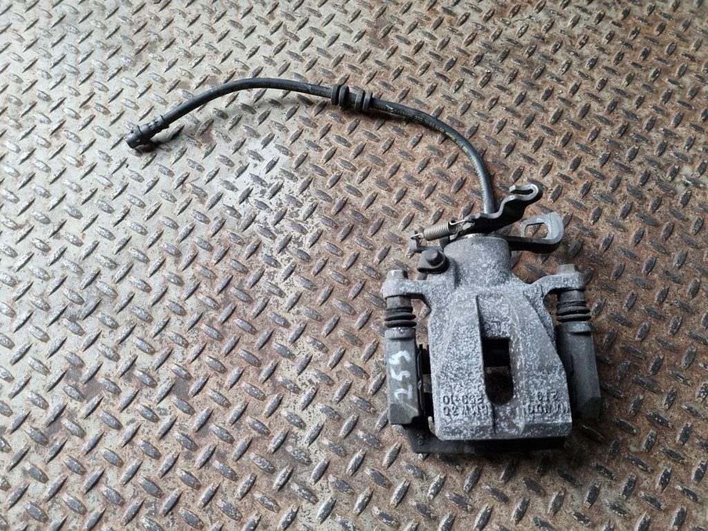 Rear brake caliper – left